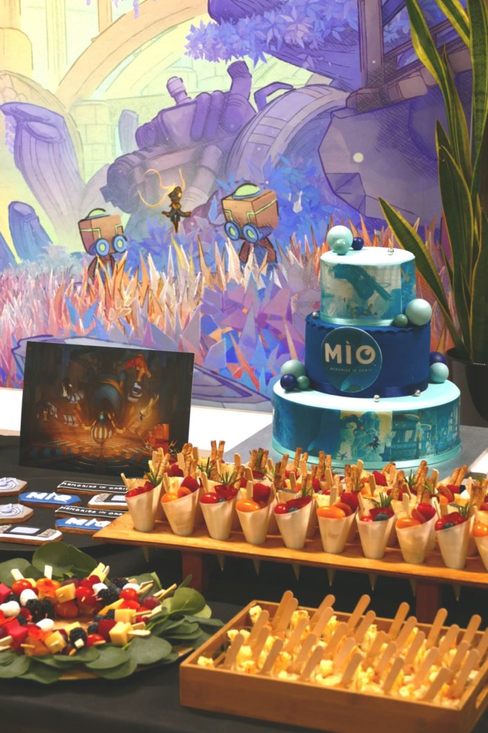 Évènement pour le lancement du nouveau jeu vidéo MIO pour Pull Up avec de la nourriture sucré salé et un gateau personnalisé