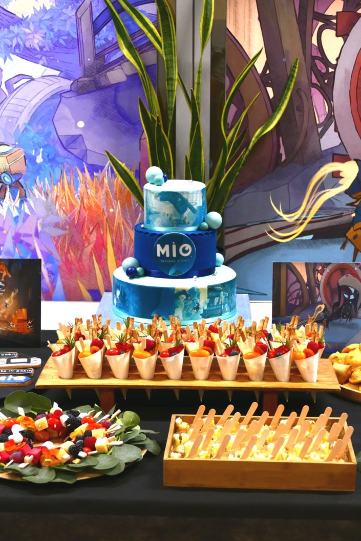 Évènement pour le lancement du nouveau jeu vidéo MIO pour Pull Up avec de la nourriture sucré salé et un gateau personnalisé